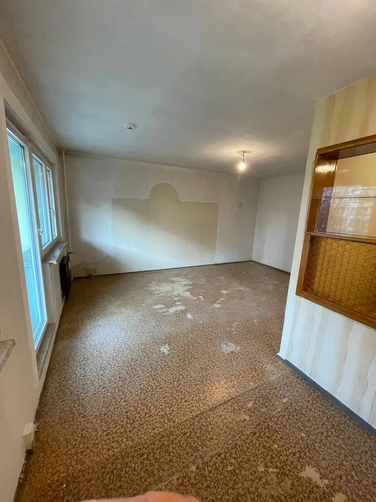 Partly cleared room during the flat clearance